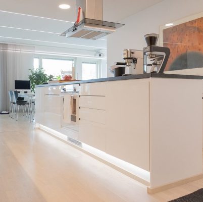 Plinth lighting with 7,2W/m LED strip in kitchen.
