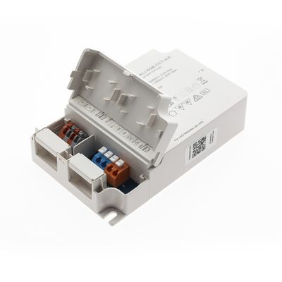 Apparecchio elettrico grigio con coperchio aperto, che rivela connettori colorati e scomparti etichettati; ideale per installazioni di illuminazione a LED.