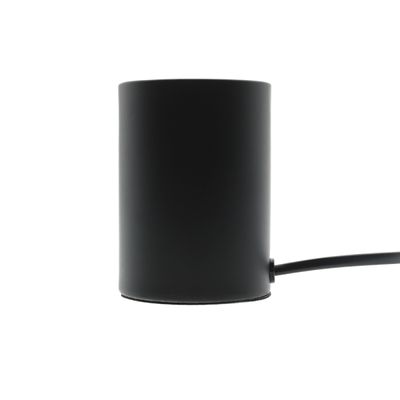 Cilindro nero con controller LED e cavo di alimentazione su sfondo bianco, dettagli del componente di illuminazione