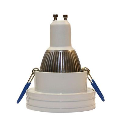 Testo alternativo: 'Faretto LED bianco e argento ad alta efficienza energetica con due supporti blu sulla base, ideale per soluzioni di illuminazione contemporanea.