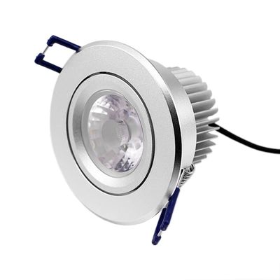 Plafoniera LED da incasso color argento con design rotondo, griglie di dissipazione del calore, supporti blu e cablaggio nero. Ideale per soluzioni di illuminazione contemporanea.
