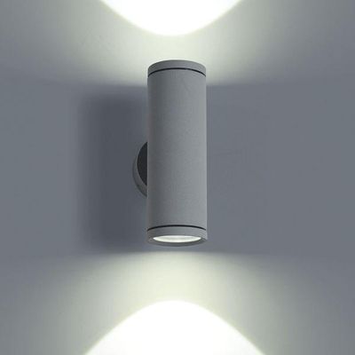 Moderna lampada da parete cilindrica con doppia distribuzione della luce e motivo decorativo a parete. Perfetta per l'illuminazione a LED.