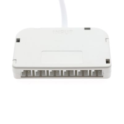 Controllore elettronico a LED bianco con porte di connessione contrassegnate da "INPUT" sulla parte superiore. Il cavo di collegamento è mostrato per facilitare l'installazione e l'uso.