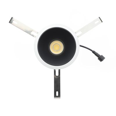 Plafoniera rotonda a incasso con interno nero, lampadina a vista, staffe di montaggio in metallo e prolunga. Ideale per sistemi di illuminazione moderni.