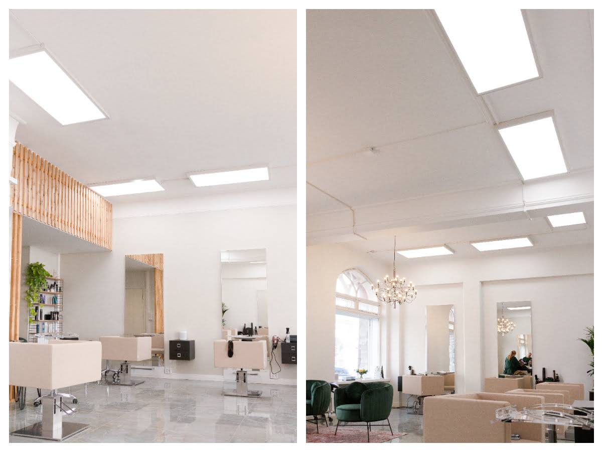 Salone chiaro con grandi pannelli LED sul soffitto.