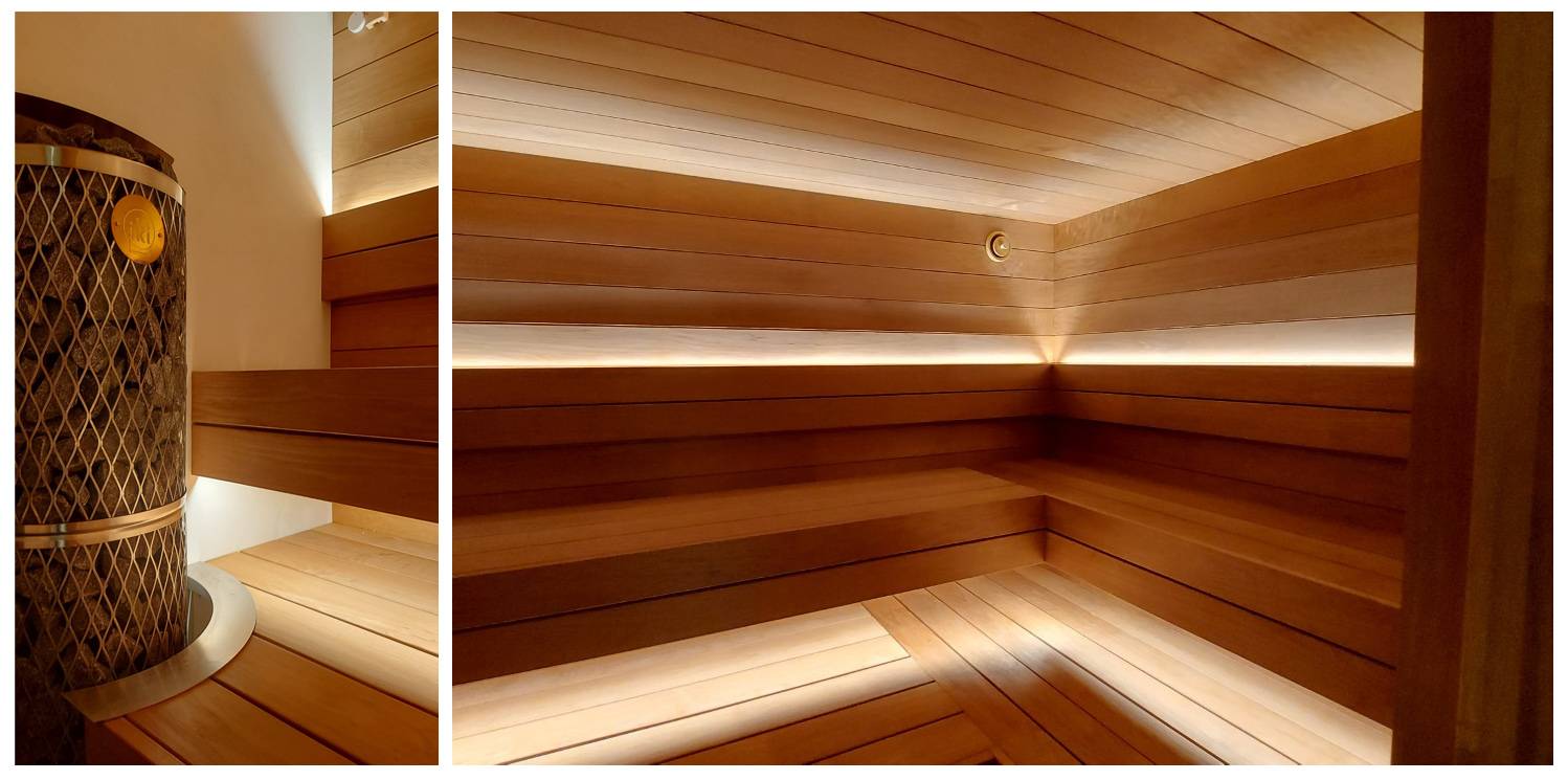 Illuminazione a led della sauna sotto il soffitto e sulla parte superiore dello schienale. Foto.